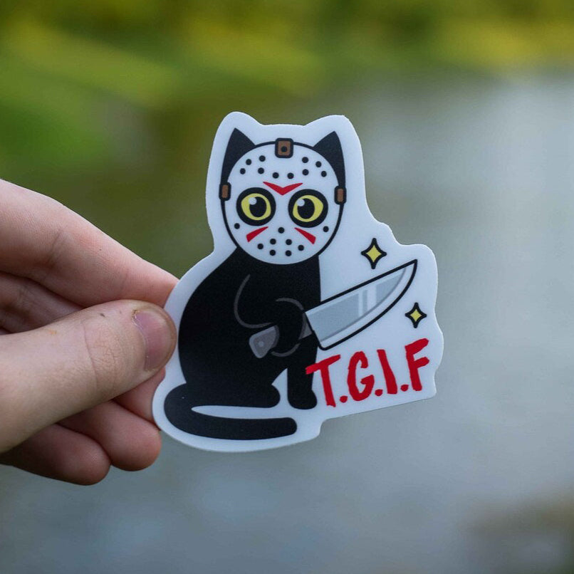 A sticker of a black cat with a hockey stick, with the text 'T.G.I.F' at the bottom.