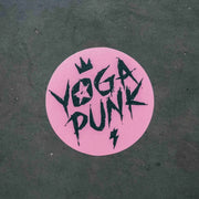 A pink sticker with the text 'YOGA PUNK' in bold black letters, designed for use as a decoration or sticker.